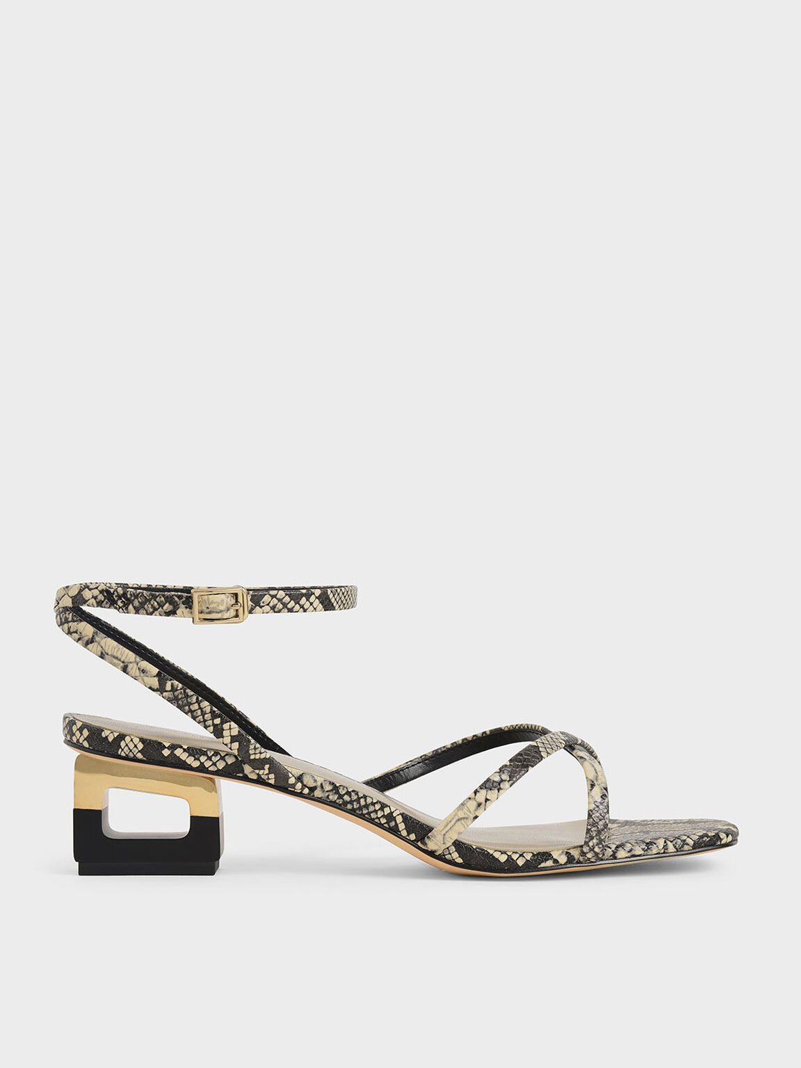 Skulpturale Sandalen mit Chromabsatz und Schlangenmuster
