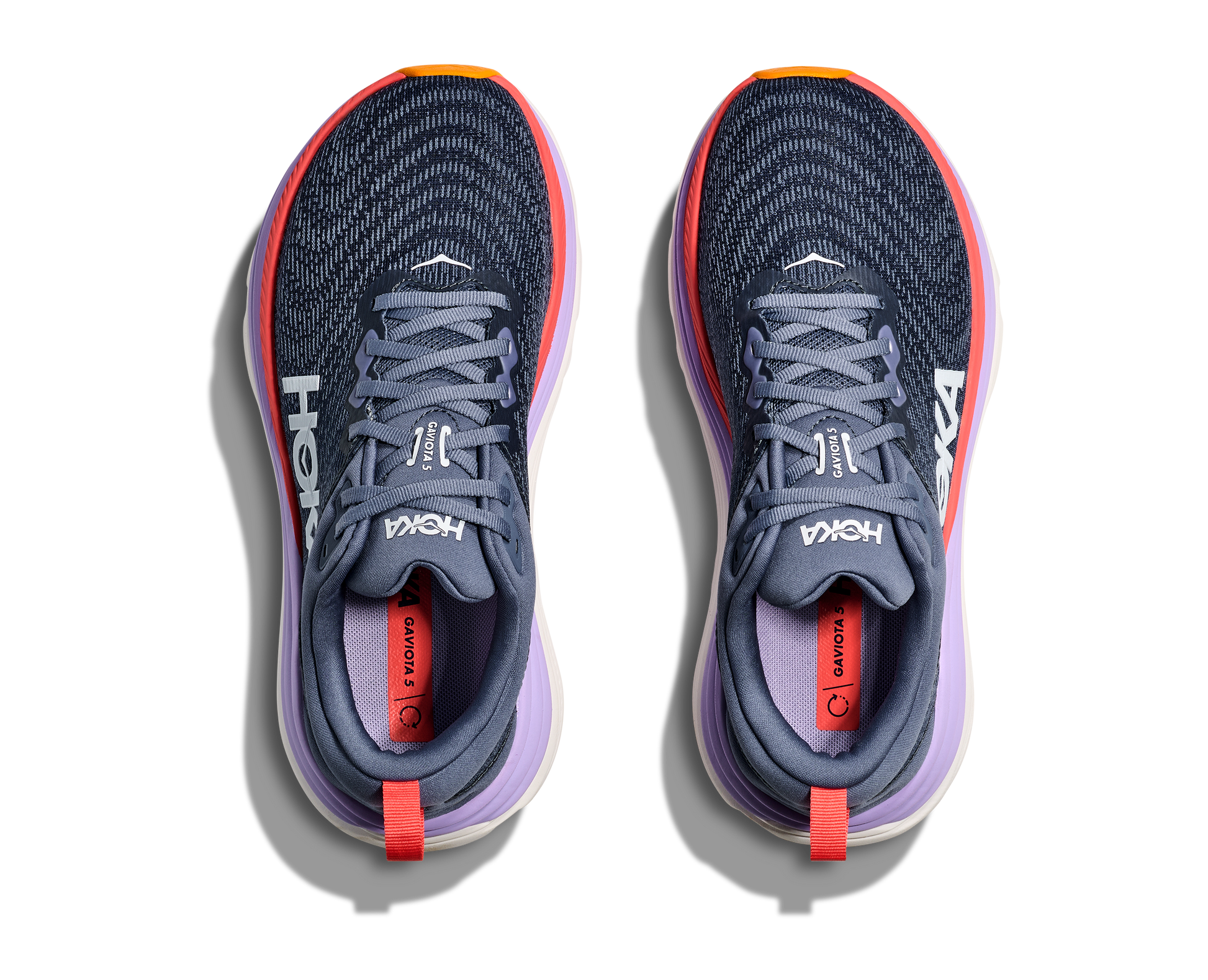 Hoka Gaviota 5 W, skomodell till dam. Denna modell är rymlig i passformen jämfört med andra Hoka skor. Här har ni Hokas stabilaste sko med pronationsstöd. Mörkblå färg i grunden med detaljer i lila, rött och orange. Perfekt för löpningen eller arbetspasset där du behöver mycket dämpning. 